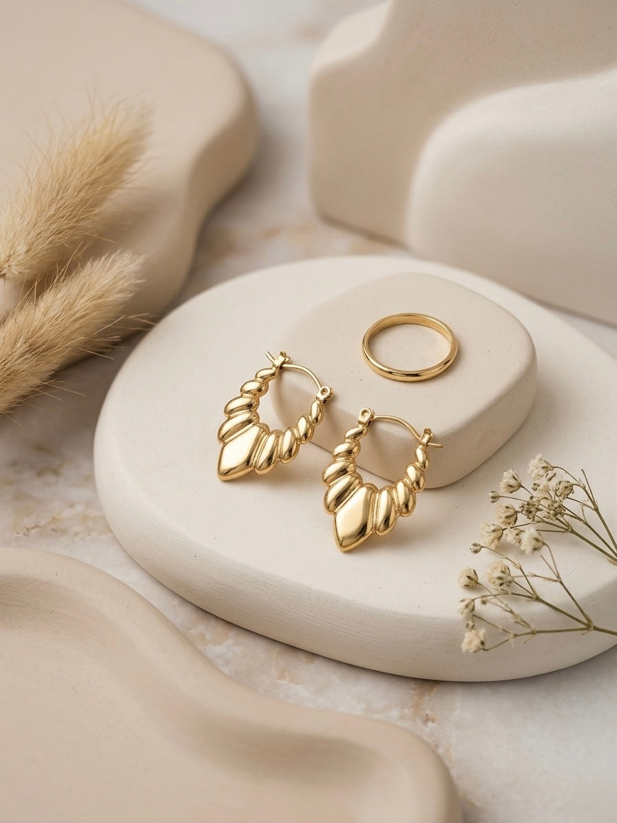 Vintage-inspired textured gold statement earrings.