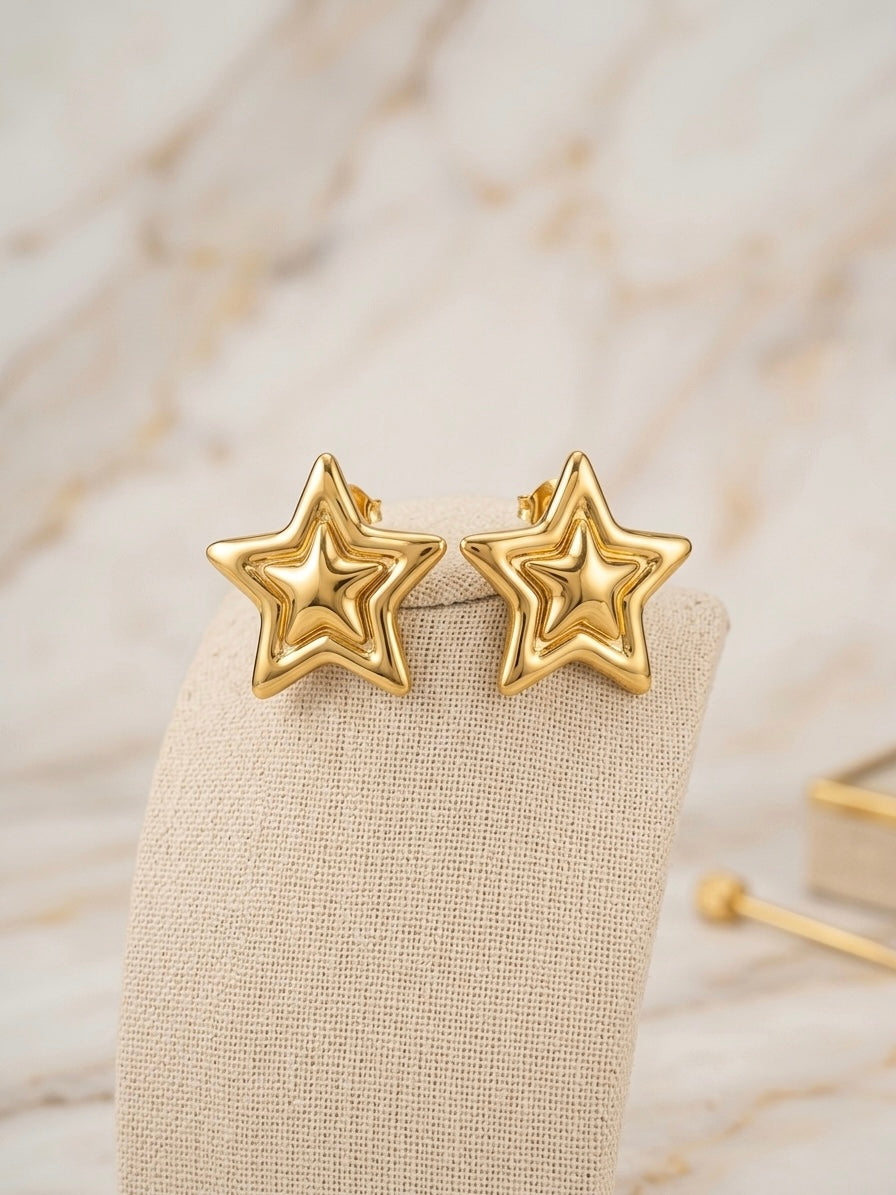 Elegant high-polish layered star earrings.