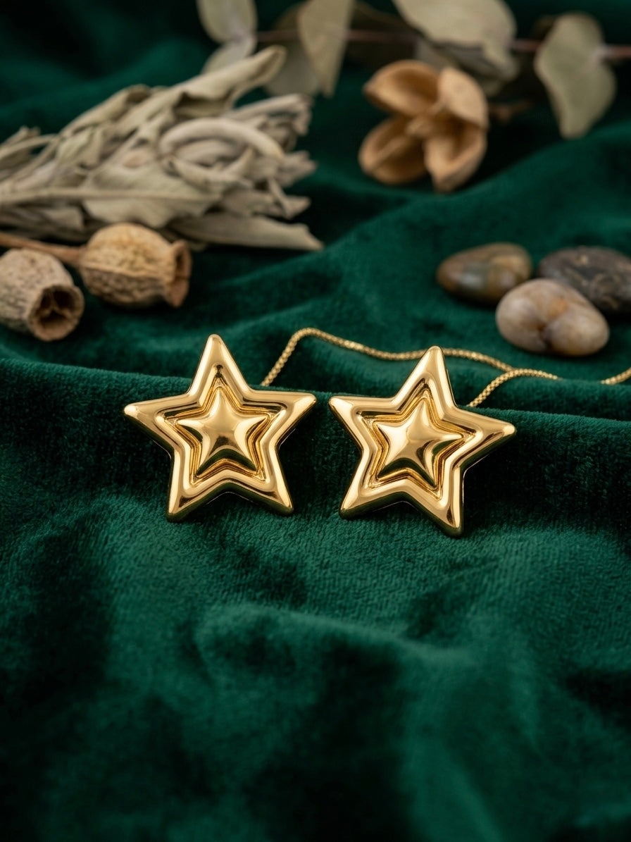 Elegant high-polish layered star earrings.
