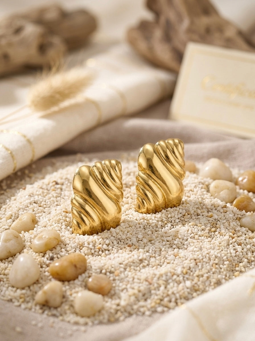 Elegant sculptural textured gold earring studs.
