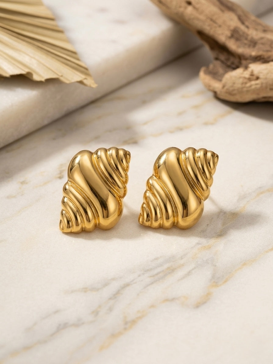 Elegant sculptural textured gold earring studs.