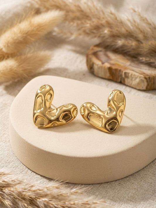 Abstract textured molten gold heart studs.