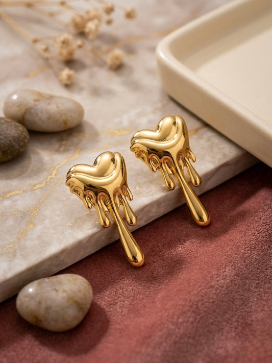 Dripping molten gold heart stud earrings.