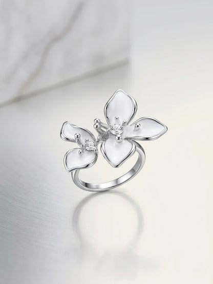 White enamel flower ring in silver tone with crystal centre