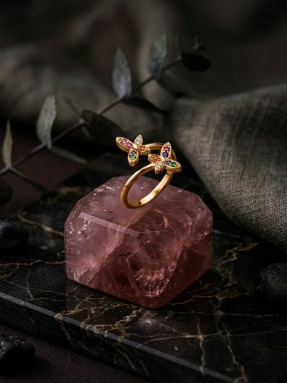 Vibrant gold bypass multicolor gemstone ring.