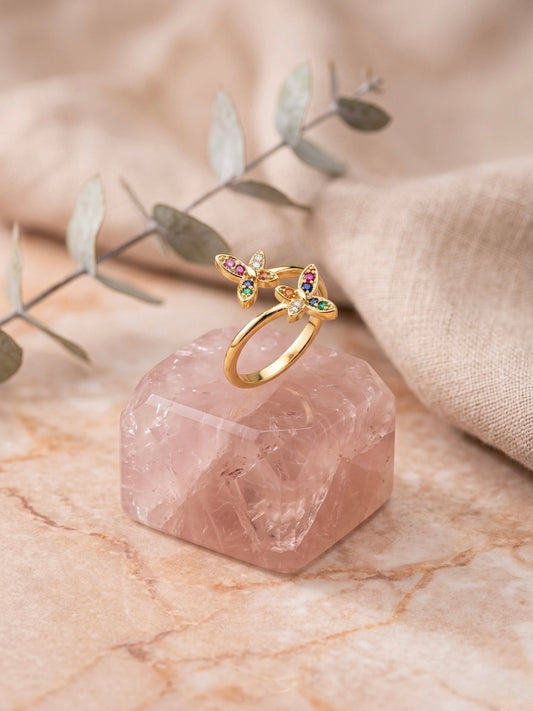 Vibrant gold bypass multicolor gemstone ring.