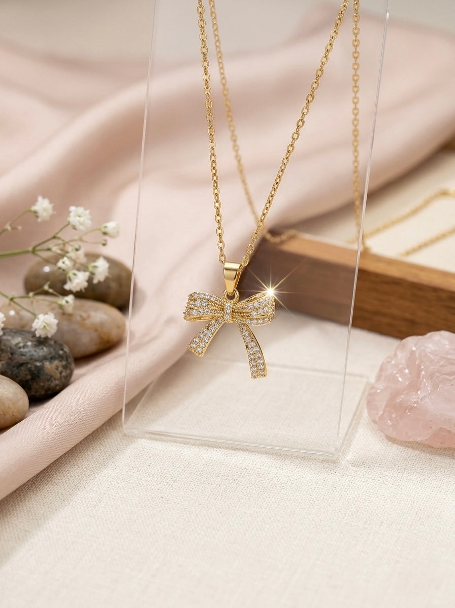 Charming gold bow pendant diamond necklace.
