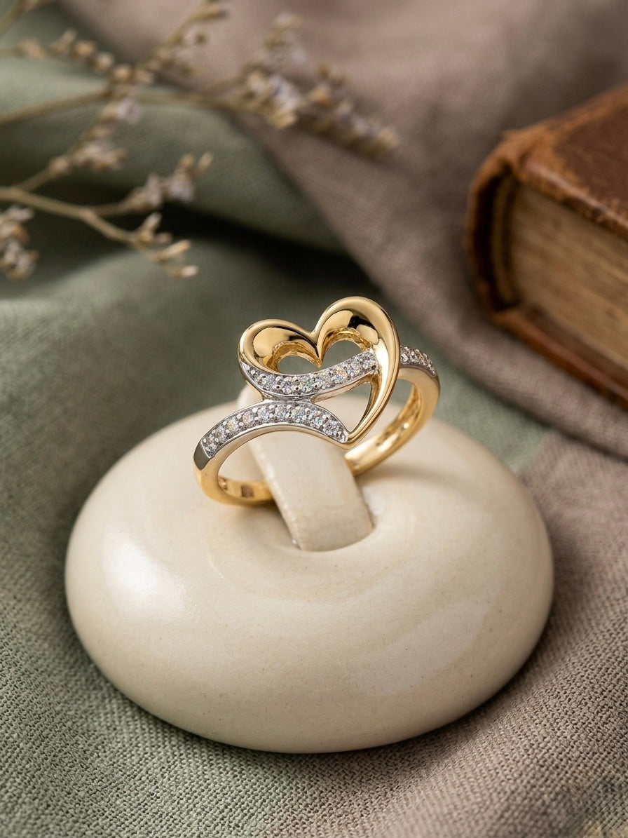 Elegant gold heart ring with diamonds.