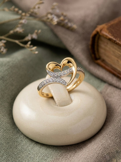 Elegant gold heart ring with diamonds.