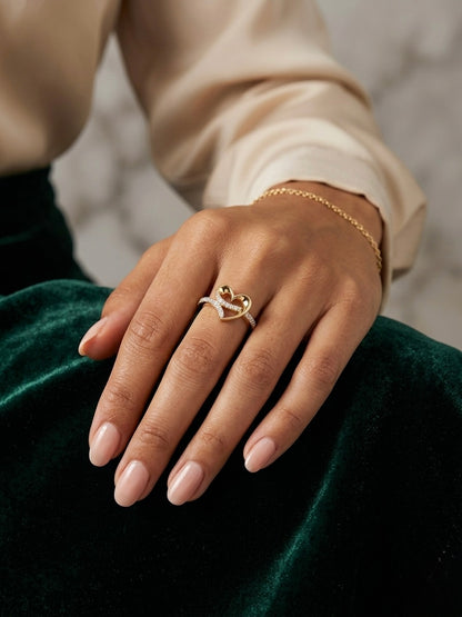 Elegant gold heart ring with diamonds.