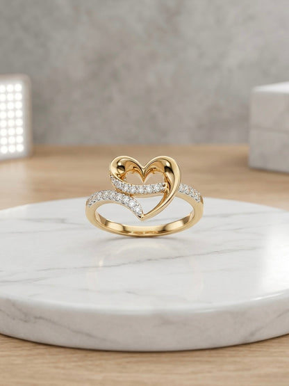 Elegant gold heart ring with diamonds.