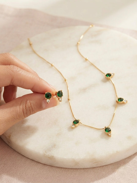 Delicate emerald stone necklace set.