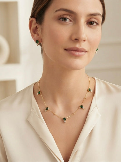 Delicate emerald stone necklace set.