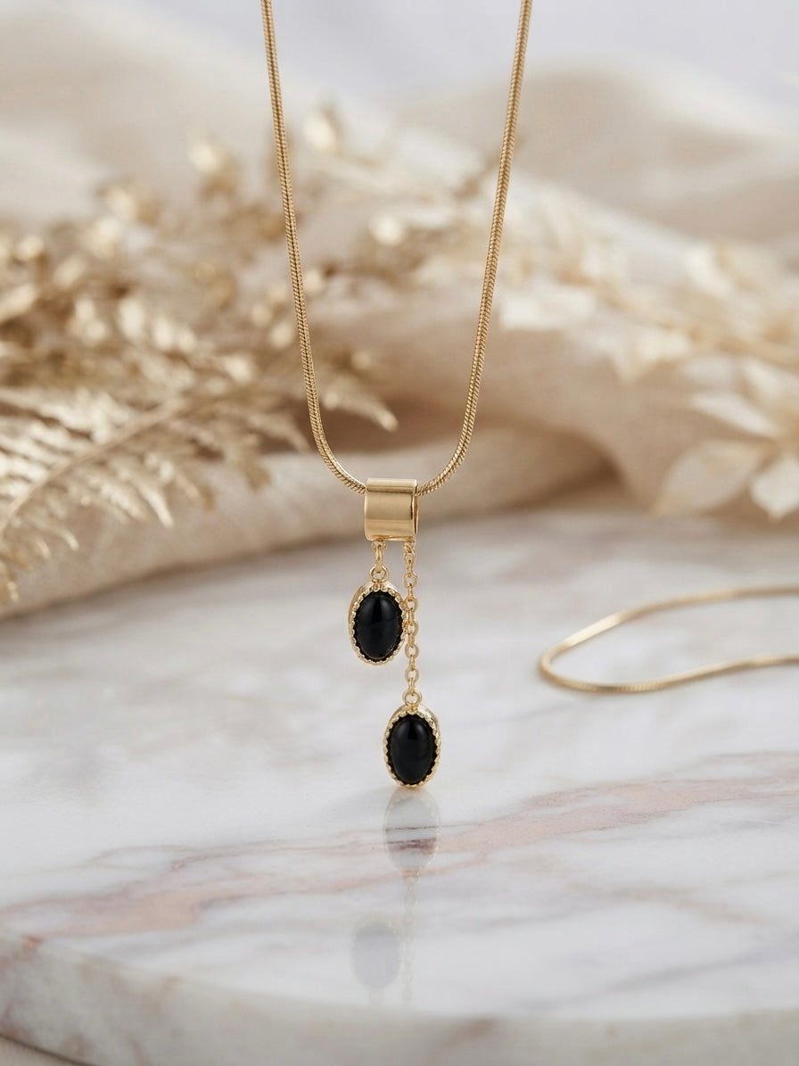 Elegant gold drop necklace set.