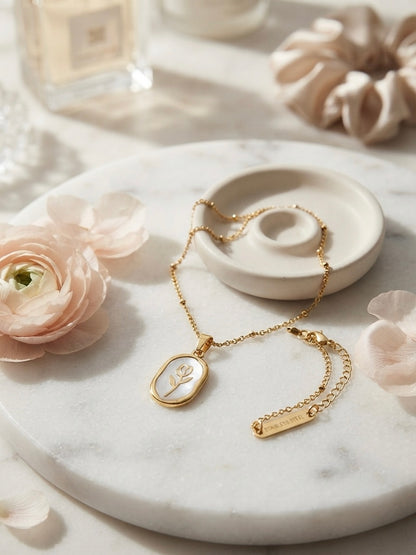 Elegant gold tulip pendant necklace.