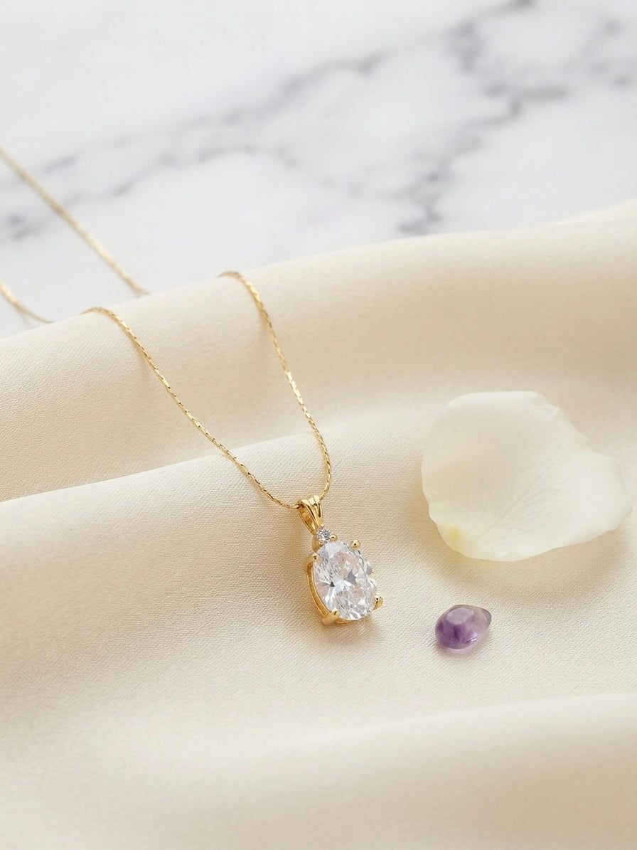Timeless gold oval solitaire necklace.