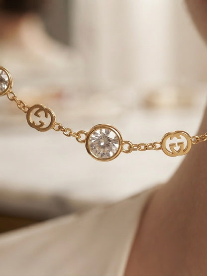 Elegant gold logo charm necklace.