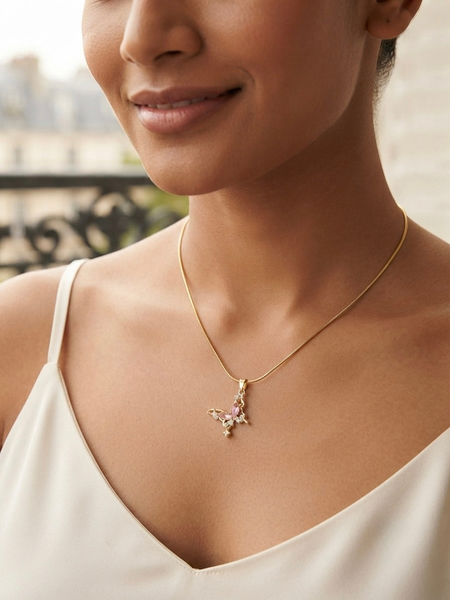 Delicate gold butterfly crystal necklace.