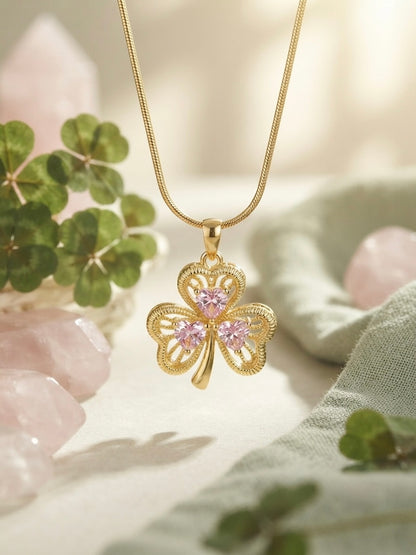 Elegant gold clover charm necklace.