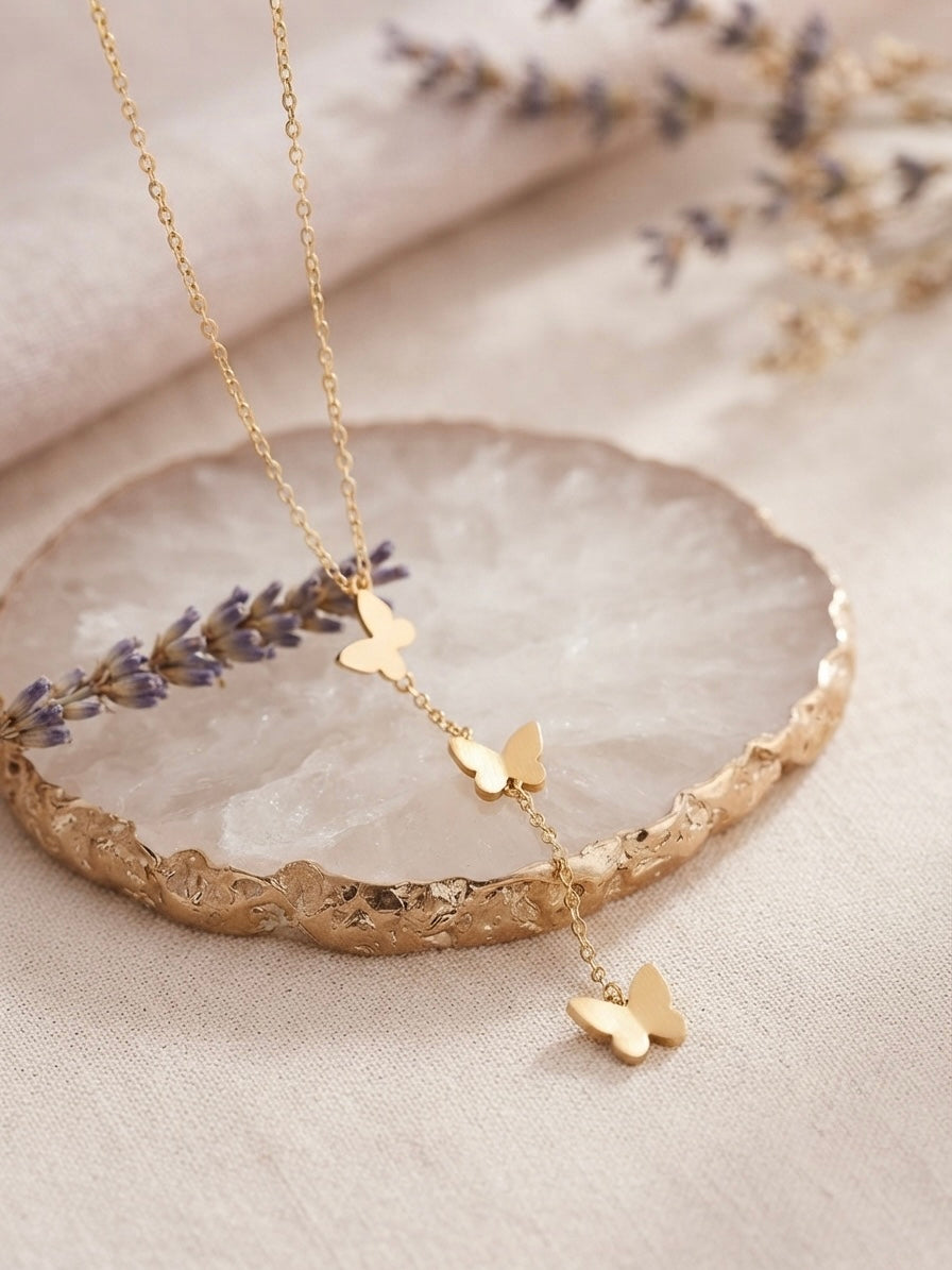 Whimsical butterfly necklace, radiant gold finish pendant.