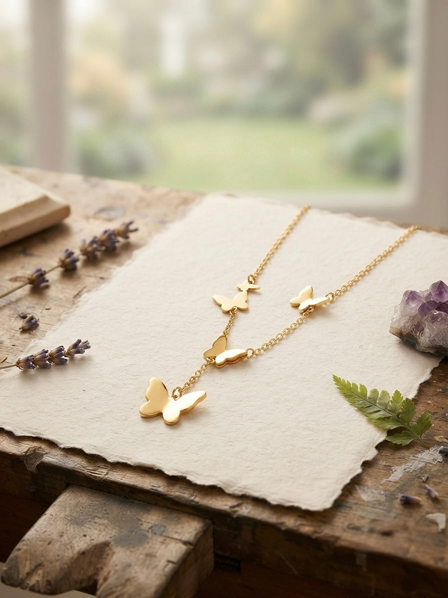 Whimsical butterfly necklace, radiant gold finish pendant.