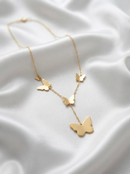 Whimsical butterfly necklace, radiant gold finish pendant.
