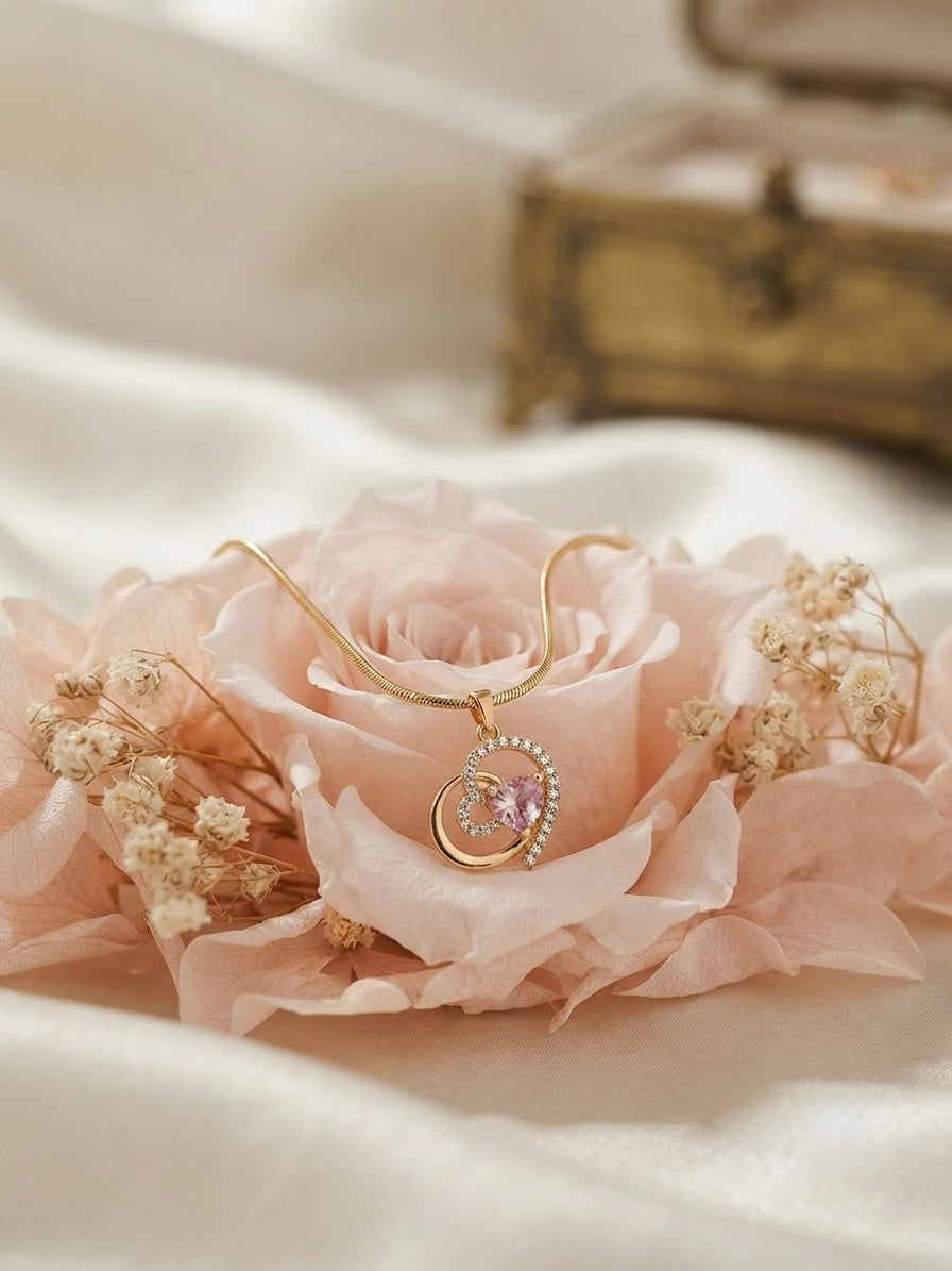 Charming heart design, sophisticated gold finish.