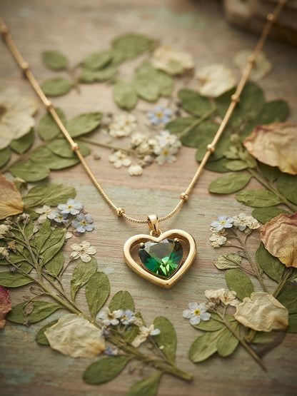 Stunning green heart, radiant gold necklace.