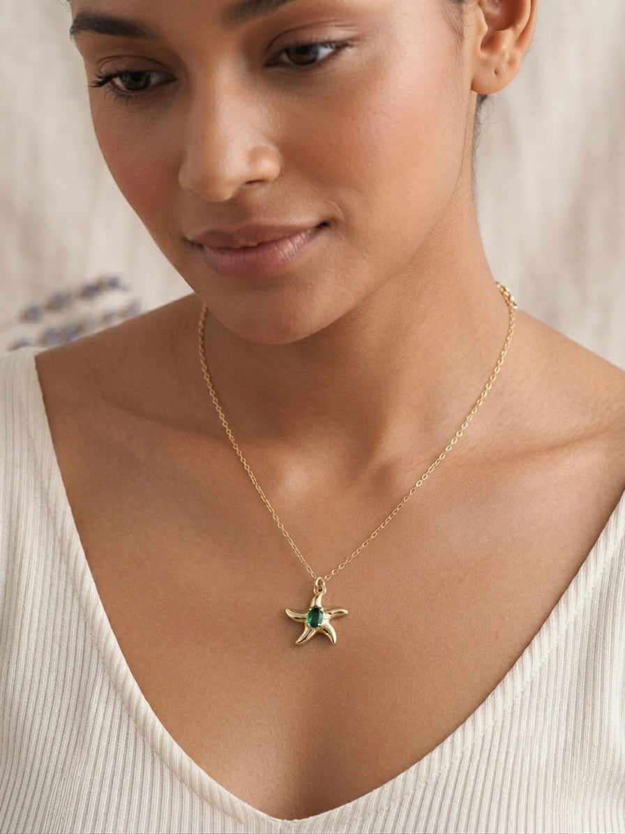 Shimmering green stone, durable gold starfish.
