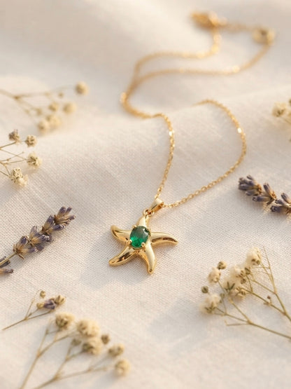 Shimmering green stone, durable gold starfish.