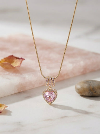 Radiant pink heart, elegant gold necklace.