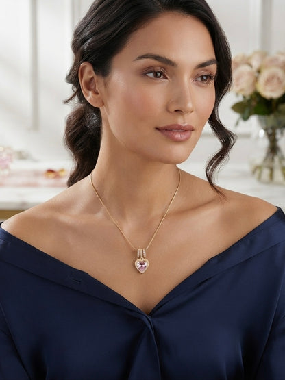 Radiant pink heart, elegant gold necklace.