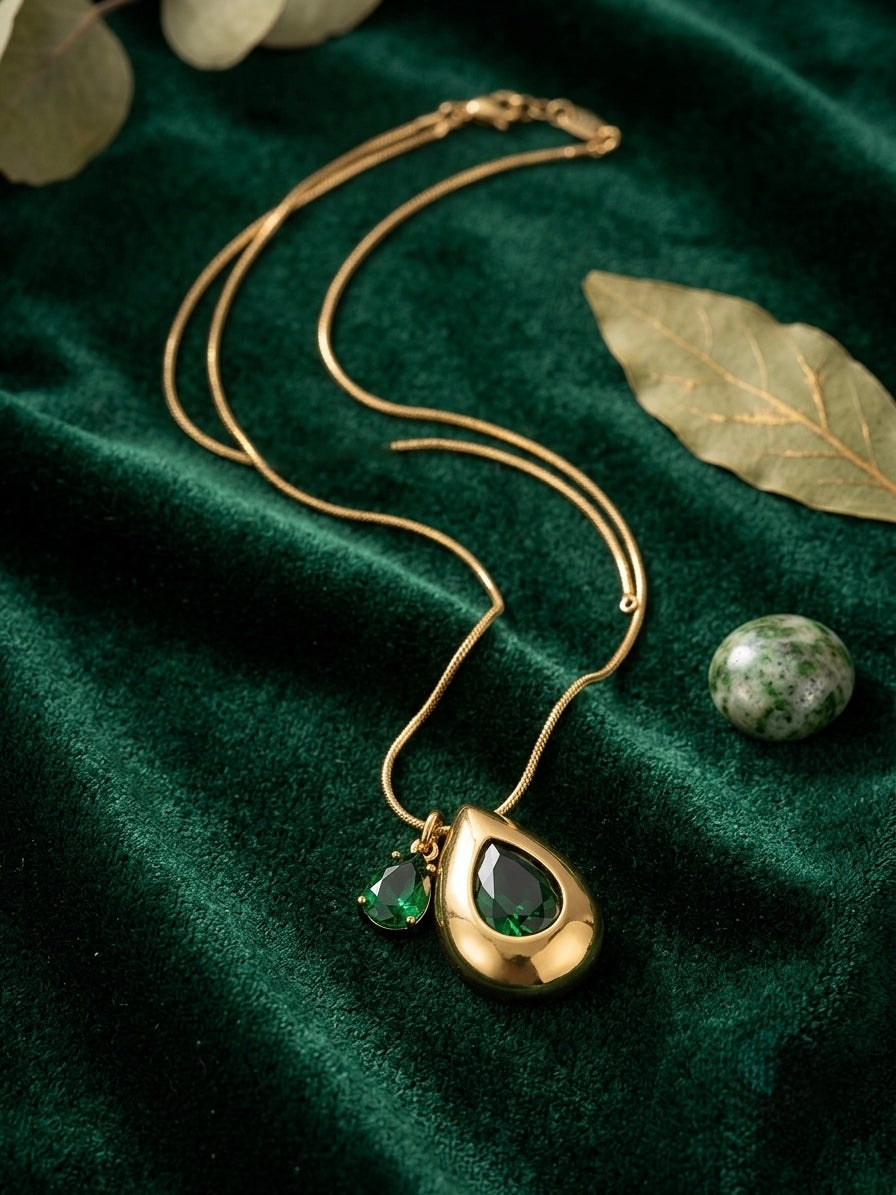 Elegant teardrop necklace, radiant gold finish.
