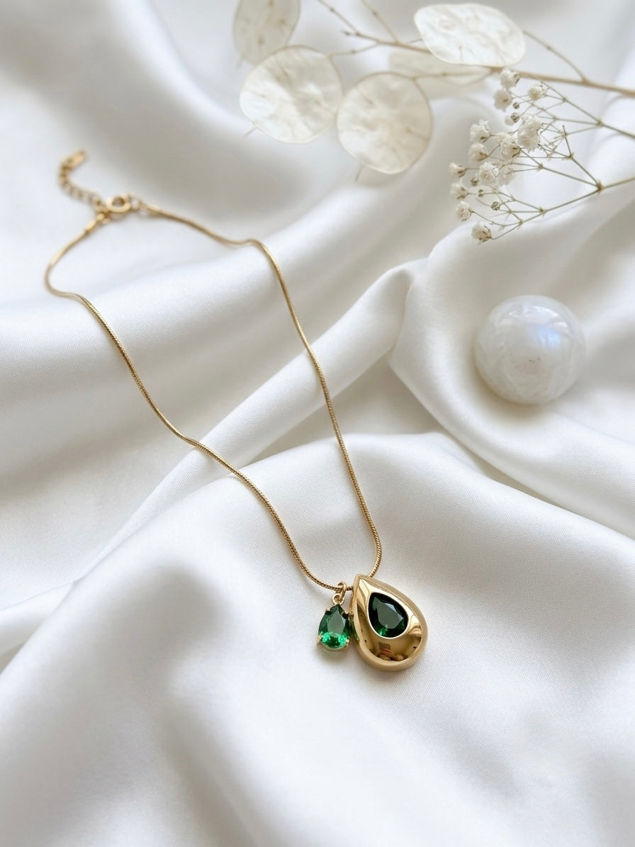 Elegant teardrop necklace, radiant gold finish.