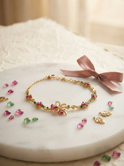 Charming floral bracelet, radiant gold finish.