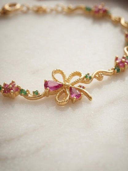 Charming floral bracelet, radiant gold finish.
