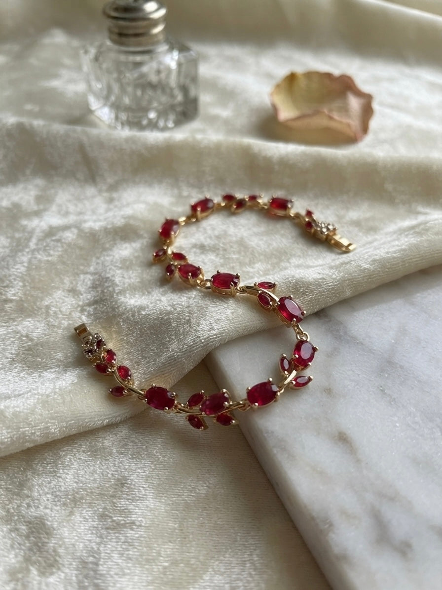 Radiant ruby-tone tulip bracelet, elegant.