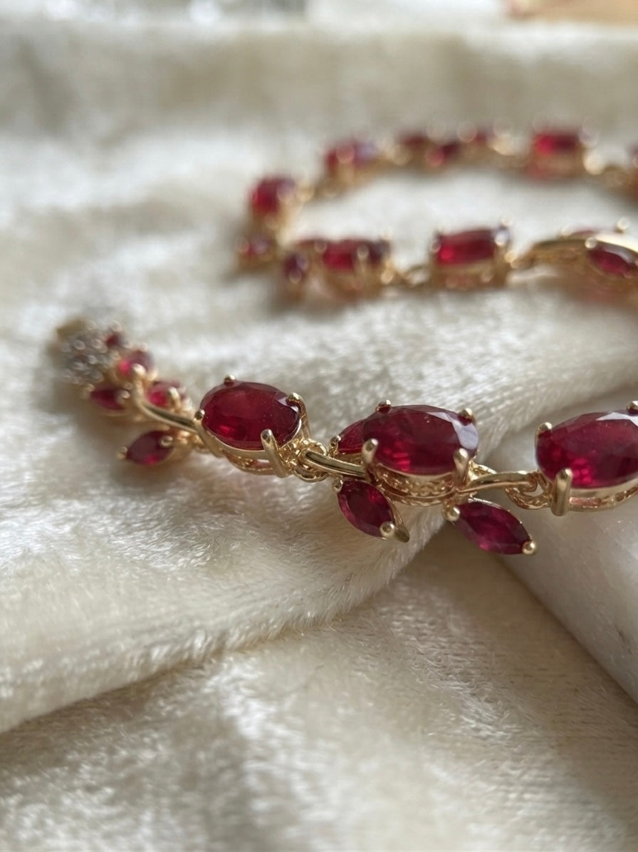 Radiant ruby-tone tulip bracelet, elegant.