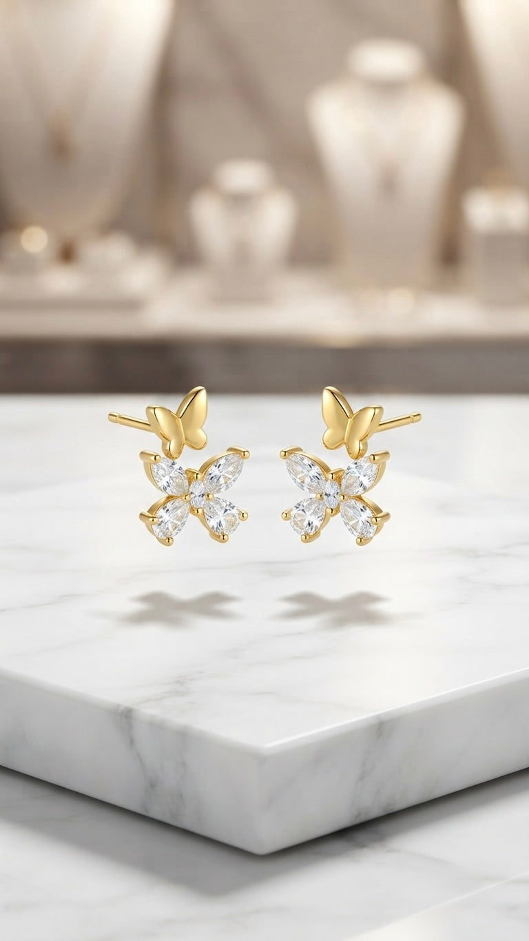 Dainty gold butterfly crystal stud earrings.