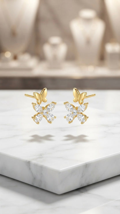 Dainty gold butterfly crystal stud earrings.