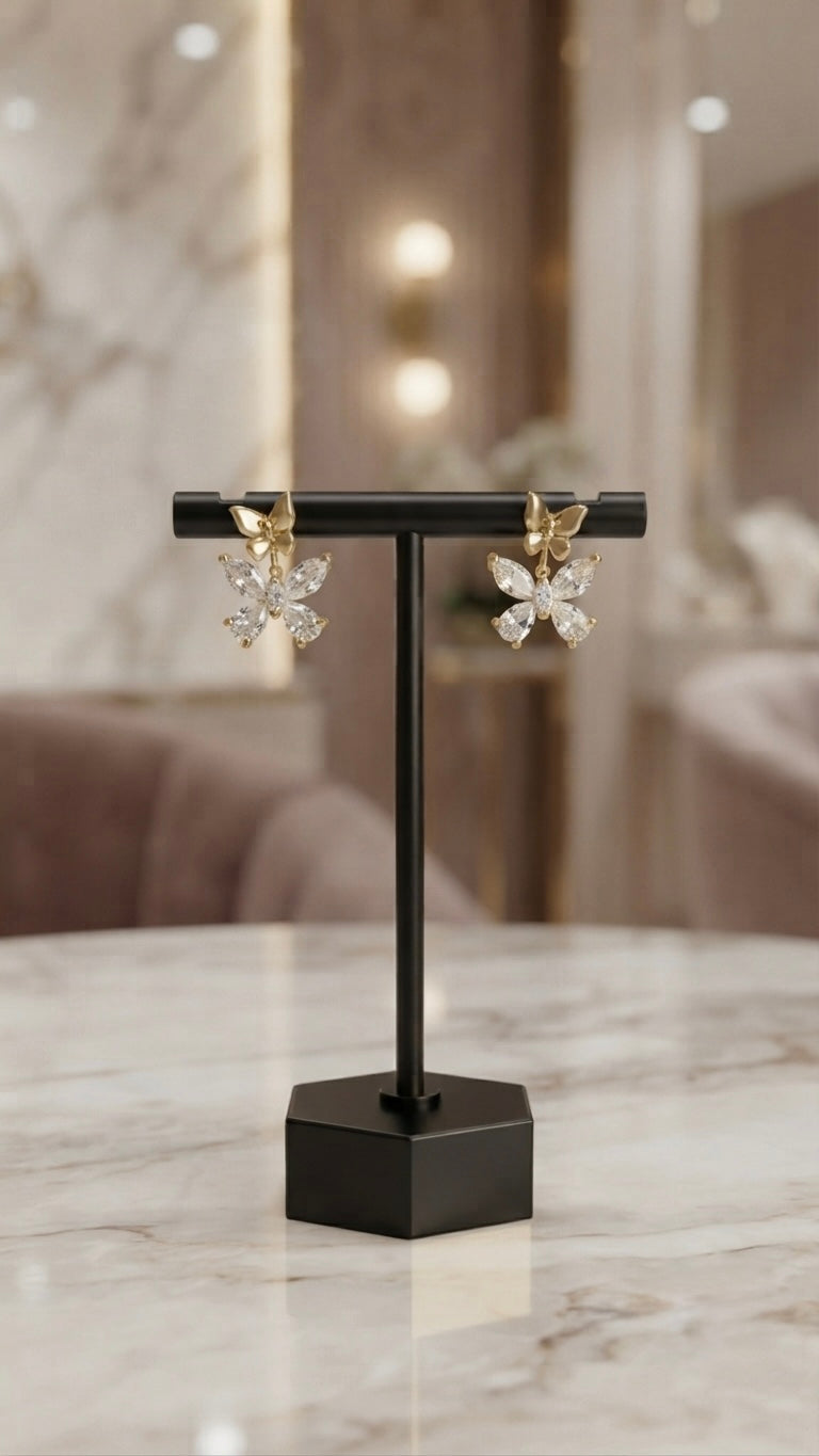 Dainty gold butterfly crystal stud earrings.