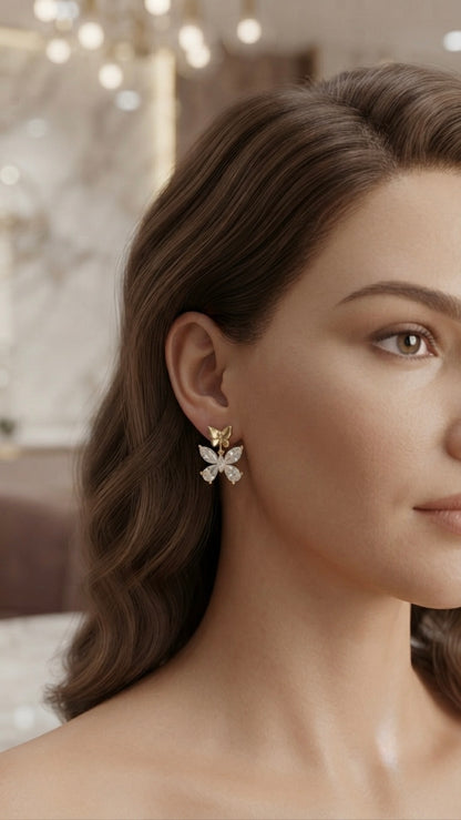 Dainty gold butterfly crystal stud earrings.