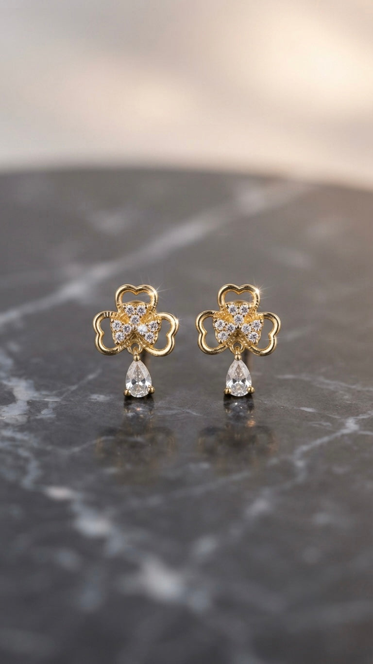 Elegant clover-inspired anti-tarnish gold earrings.