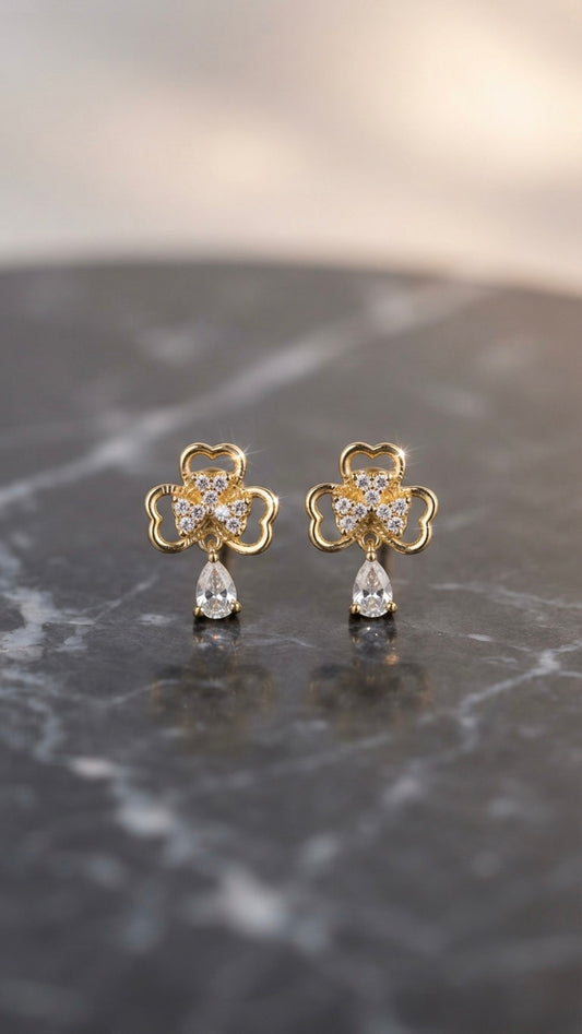 Elegant clover-inspired anti-tarnish gold earrings.