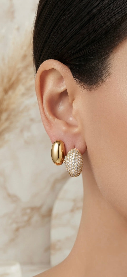 Elegant gold stud, dazzling crystal accent.
