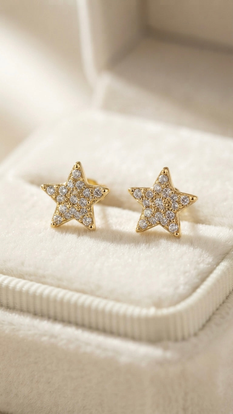 Sparkling star-shaped anti-tarnish gold studs.