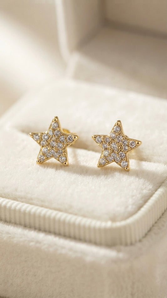 Sparkling star-shaped anti-tarnish gold studs.