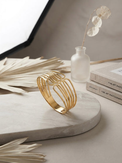 Modern architectural gold cuff bracelet.