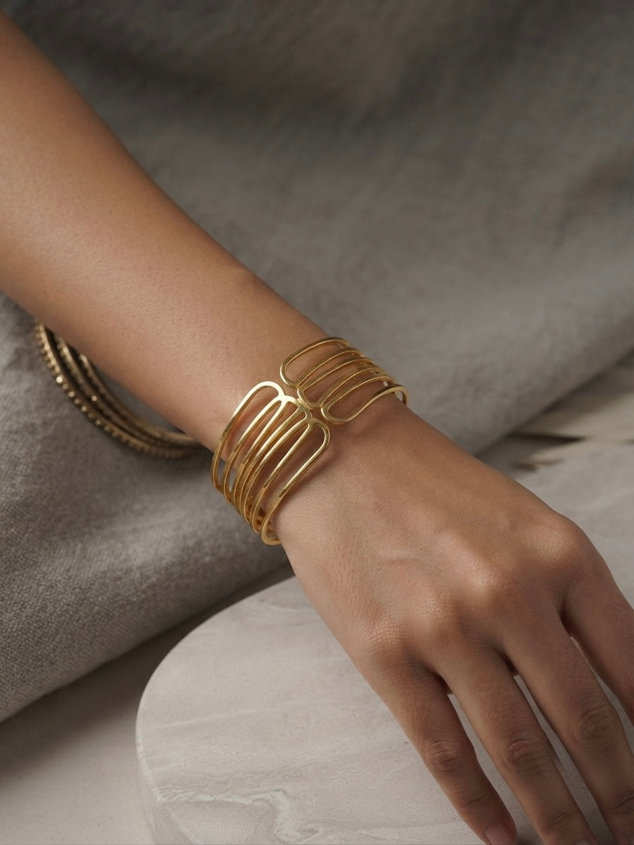 Modern architectural gold cuff bracelet.