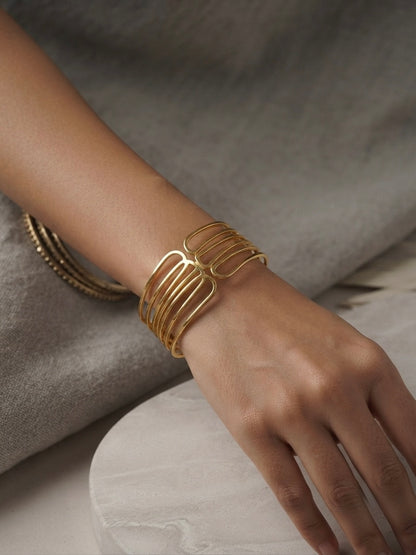 Modern architectural gold cuff bracelet.